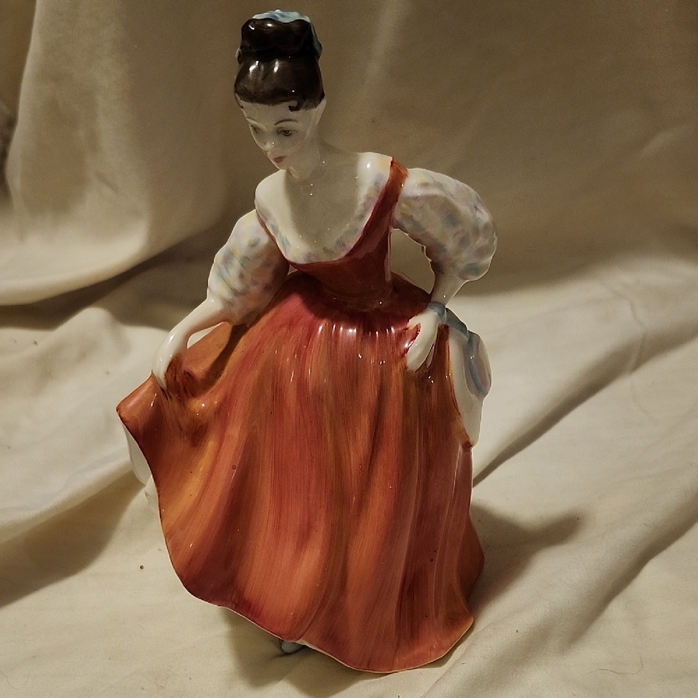 Elegant Porcelain Figurine in Red Dress